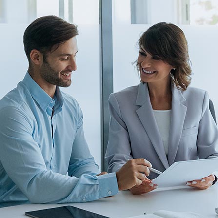 Man and woman in meeting discussing finances